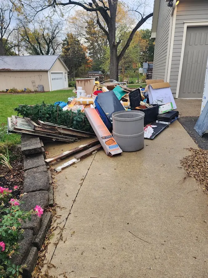 Dumpster being loaded with debris for Commercial Dumpster Rental in Richwood